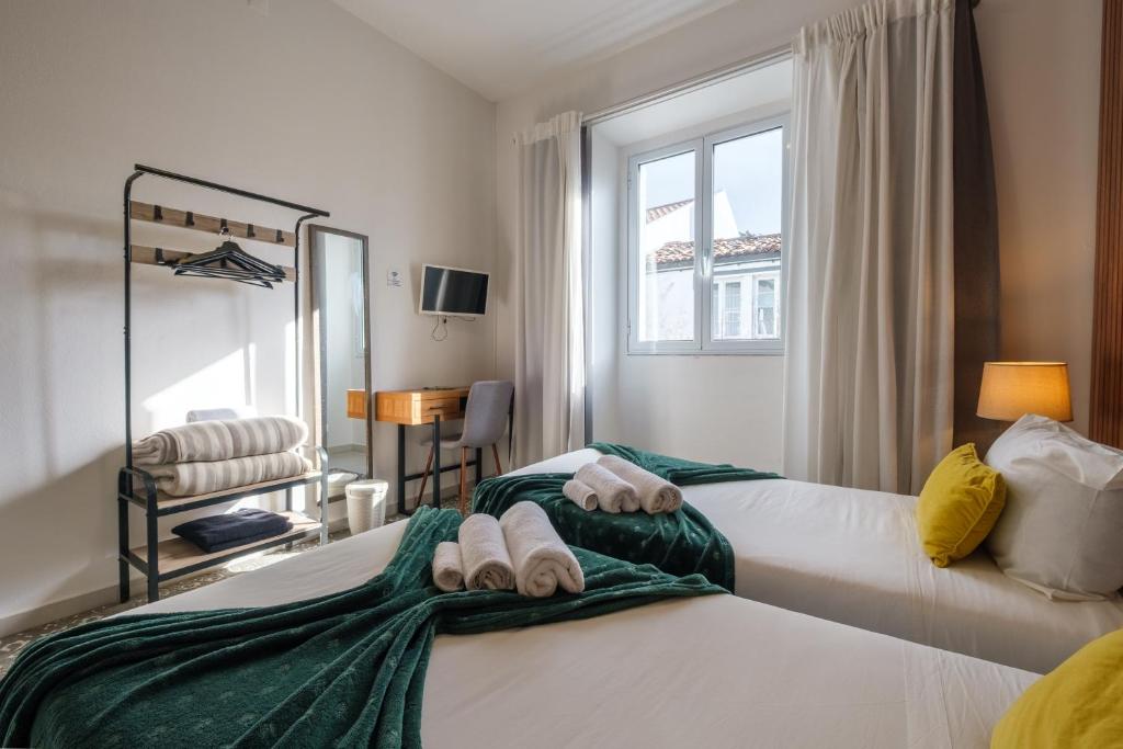 Victória Guest Houseにあるベッド