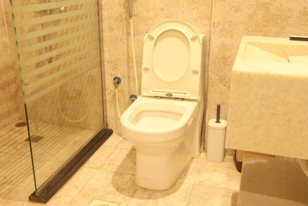 Koupelna v ubytování Areen Al Naeem Served Apartments