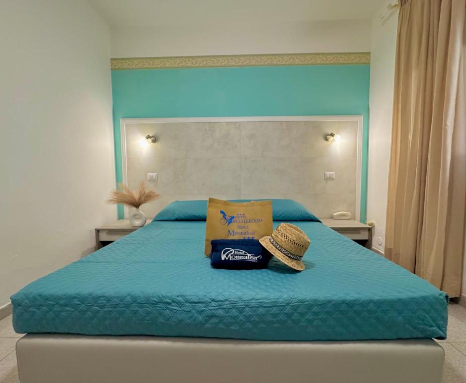 Postel nebo postele na pokoji v ubytování Hotel Monna Lisa