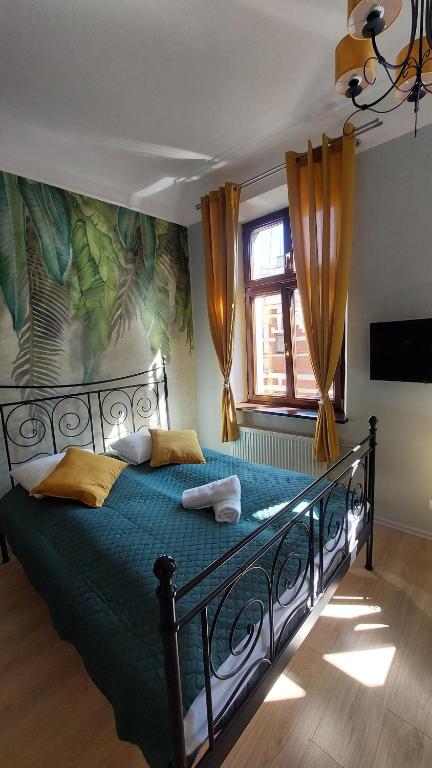 Posteľ alebo postele v izbe v ubytovaní Cozy Old Town Apartments