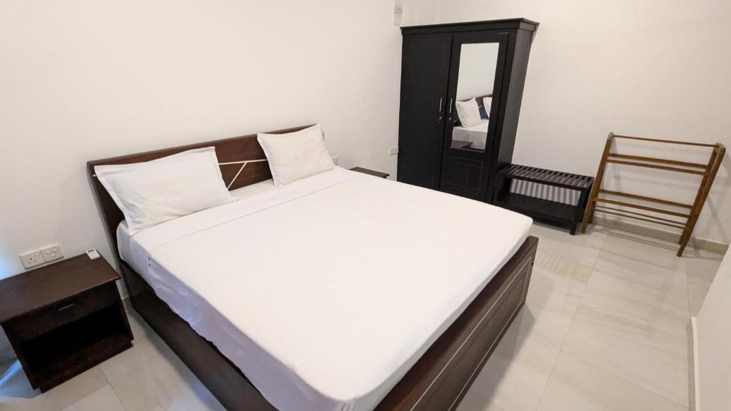 Postel nebo postele na pokoji v ubytování Dutch Villa - Trincomalee