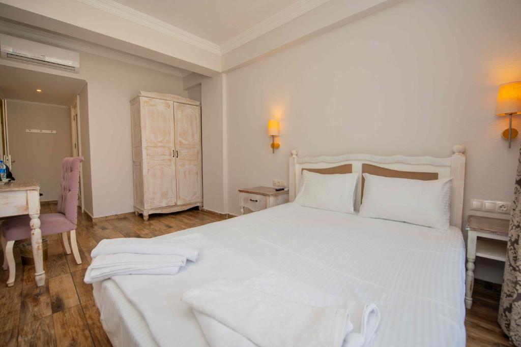 Postel nebo postele na pokoji v ubytování Cennet Life Hotel