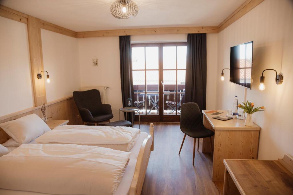 Postel nebo postele na pokoji v ubytování ALPENHOF Westerbuchberg