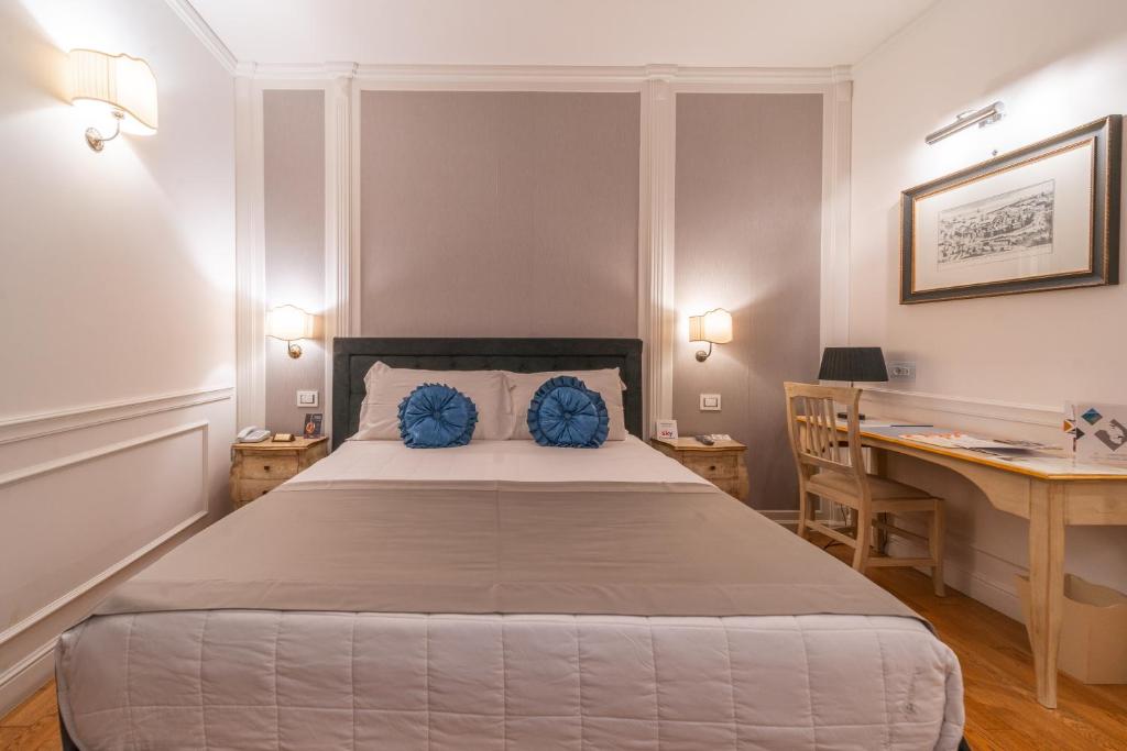 Postel nebo postele na pokoji v ubytování Tesoretto Hotel