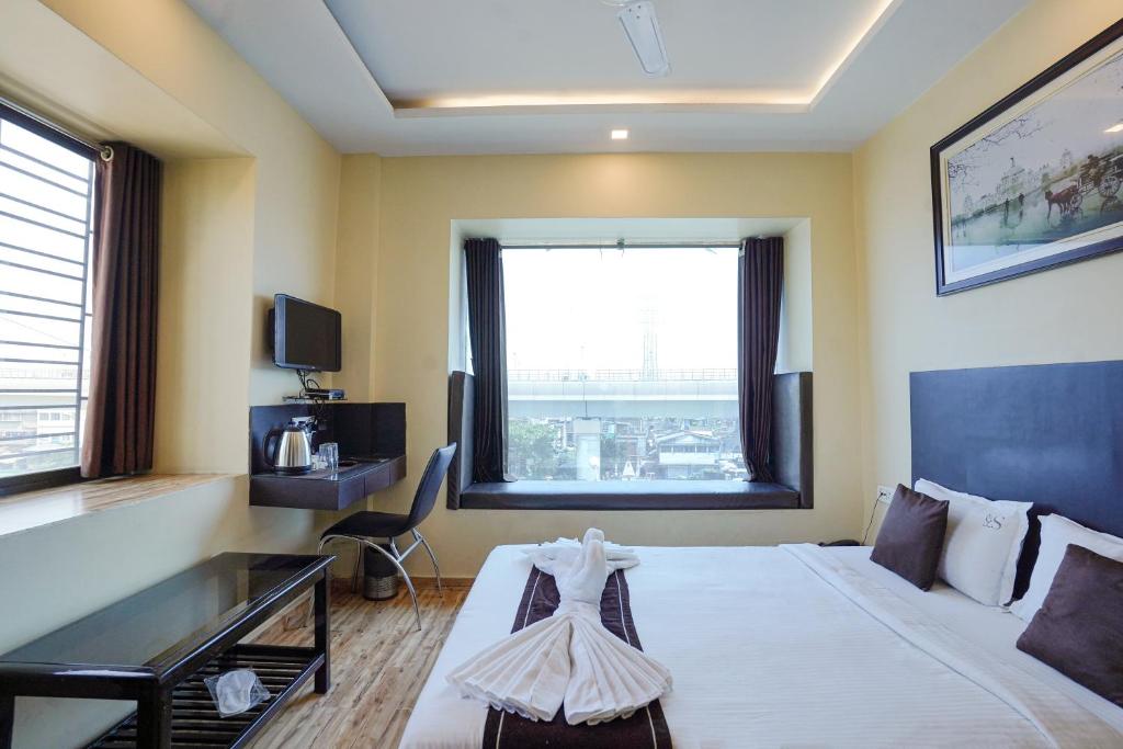 TV a/nebo společenská místnost v ubytování Hotel Sheldon International Near Science City