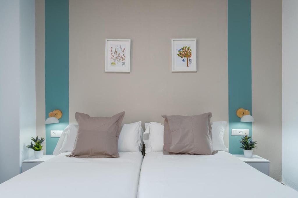 Postel nebo postele na pokoji v ubytování Hotel Boutique Puerta del Rincón