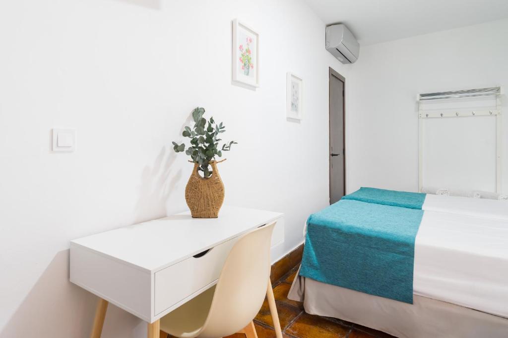 Postel nebo postele na pokoji v ubytování Hotel Boutique Puerta del Rincón