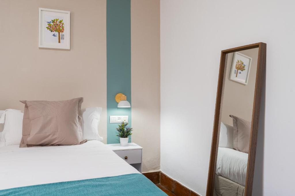Postel nebo postele na pokoji v ubytování Hotel Boutique Puerta del Rincón