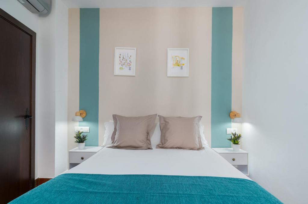 Postel nebo postele na pokoji v ubytování Hotel Boutique Puerta del Rincón