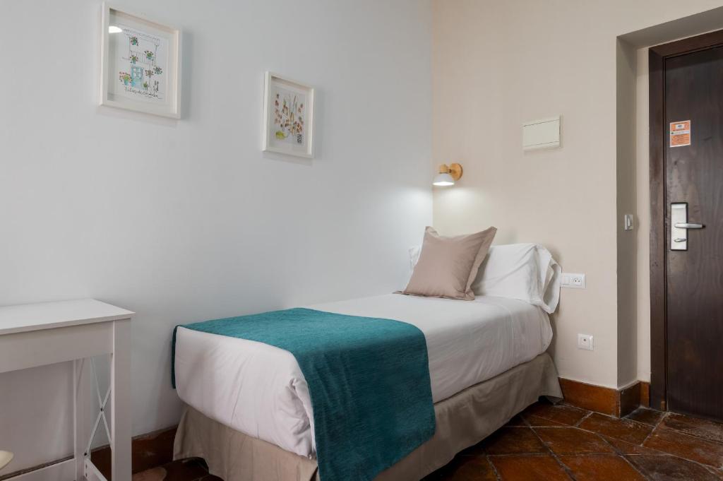 Postel nebo postele na pokoji v ubytování Hotel Boutique Puerta del Rincón