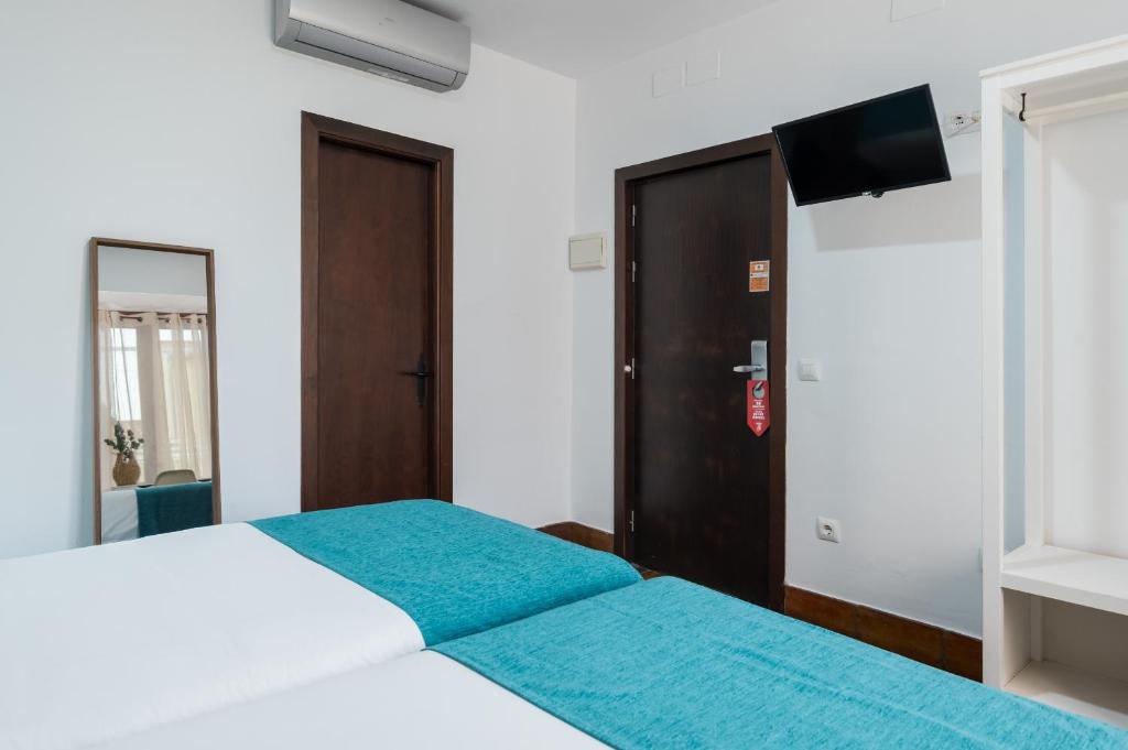Postel nebo postele na pokoji v ubytování Hotel Boutique Puerta del Rincón