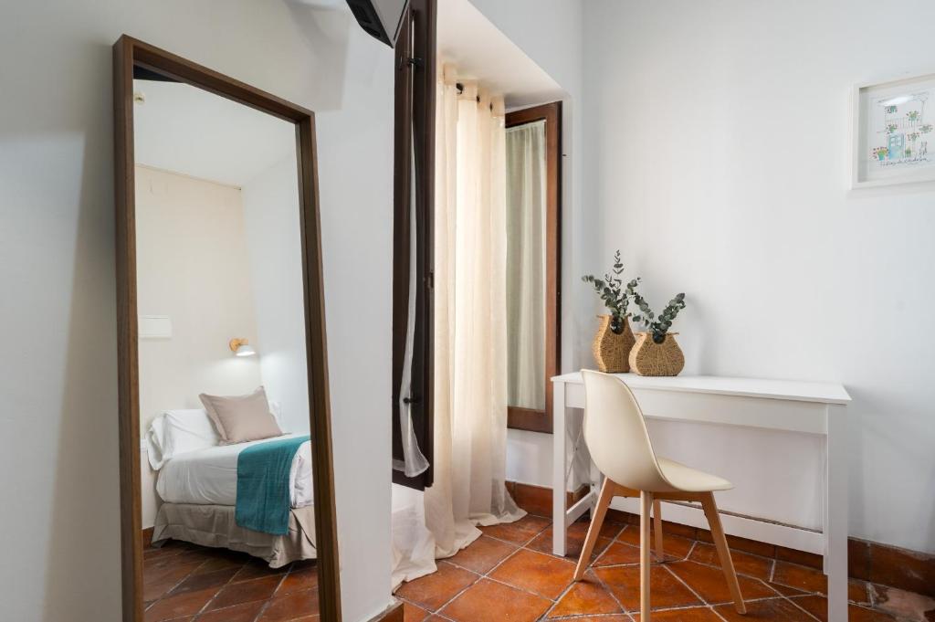 Postel nebo postele na pokoji v ubytování Hotel Boutique Puerta del Rincón