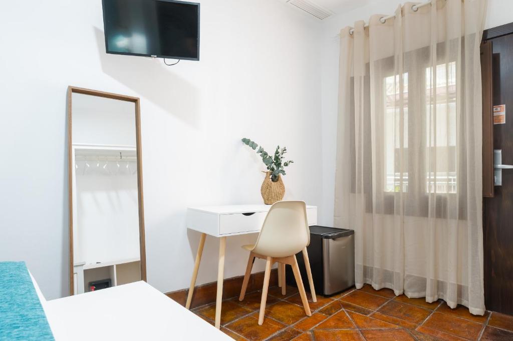 TV a/nebo společenská místnost v ubytování Hotel Boutique Puerta del Rincón