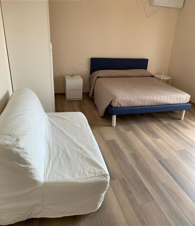 Łóżko lub łóżka w pokoju w obiekcie La Casa de Anto'