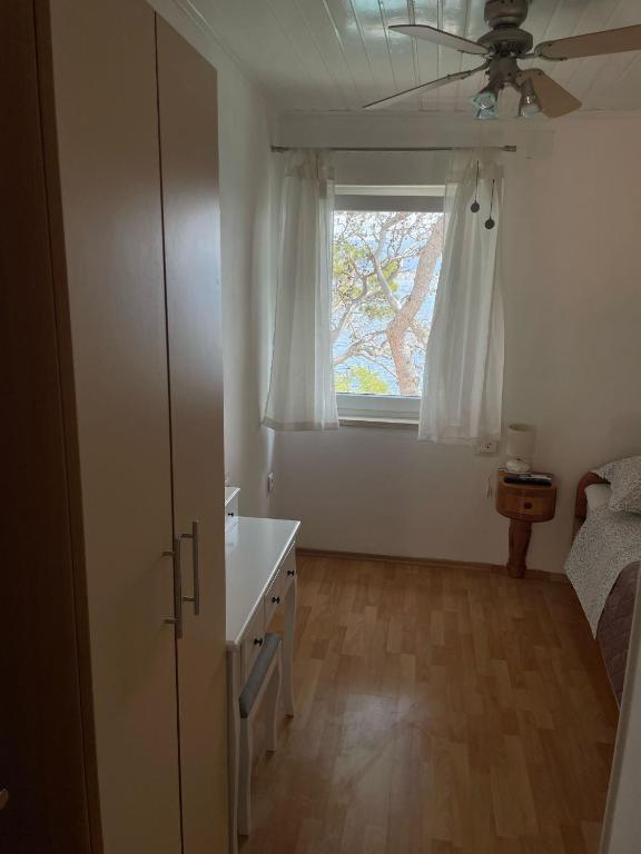 Postel nebo postele na pokoji v ubytování Apartments & Room Nina