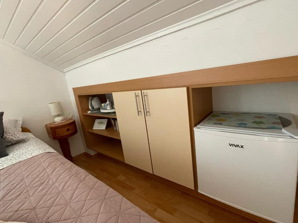 Postel nebo postele na pokoji v ubytování Apartments & Room Nina