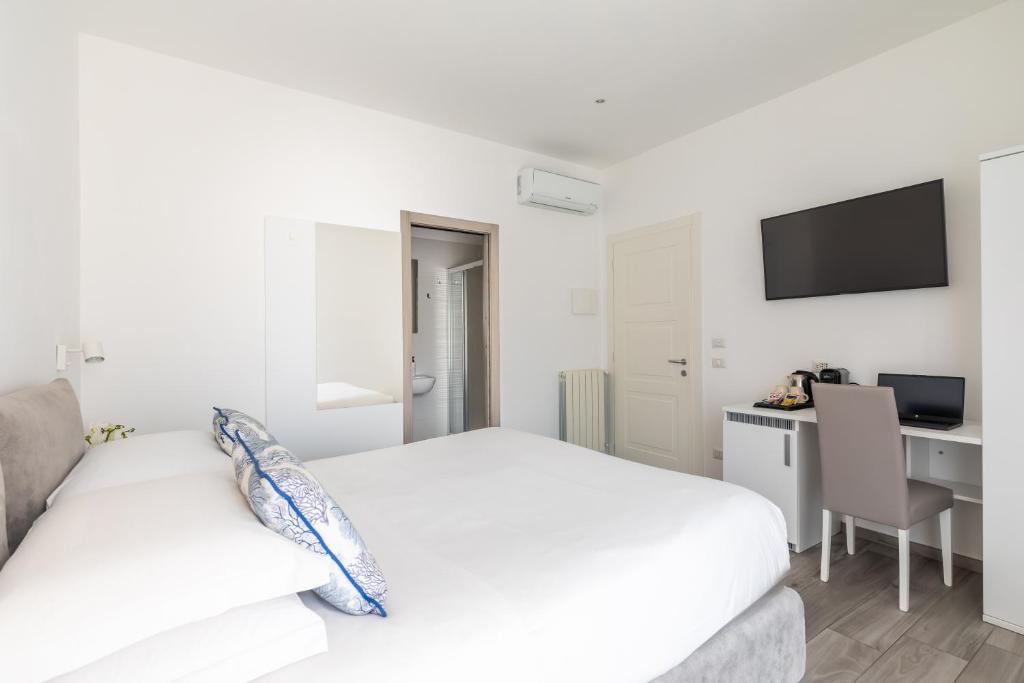 Postel nebo postele na pokoji v ubytování YourHome - Maison degli Aranci