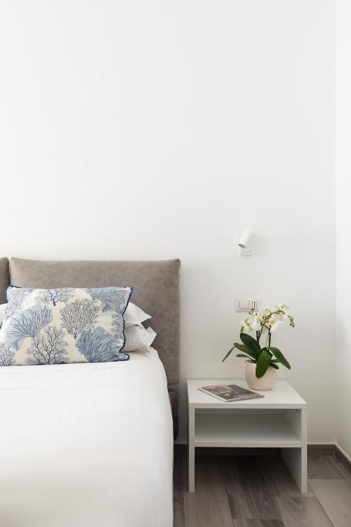 Postel nebo postele na pokoji v ubytování YourHome - Maison degli Aranci