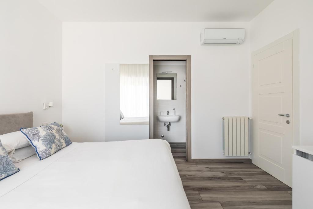 Postel nebo postele na pokoji v ubytování YourHome - Maison degli Aranci