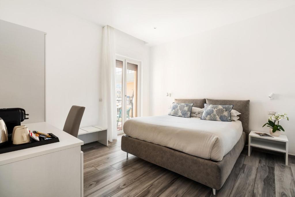 Postel nebo postele na pokoji v ubytování YourHome - Maison degli Aranci