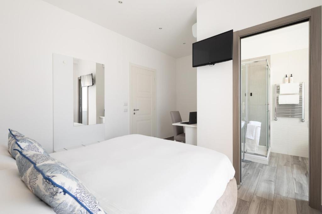 Postel nebo postele na pokoji v ubytování YourHome - Maison degli Aranci