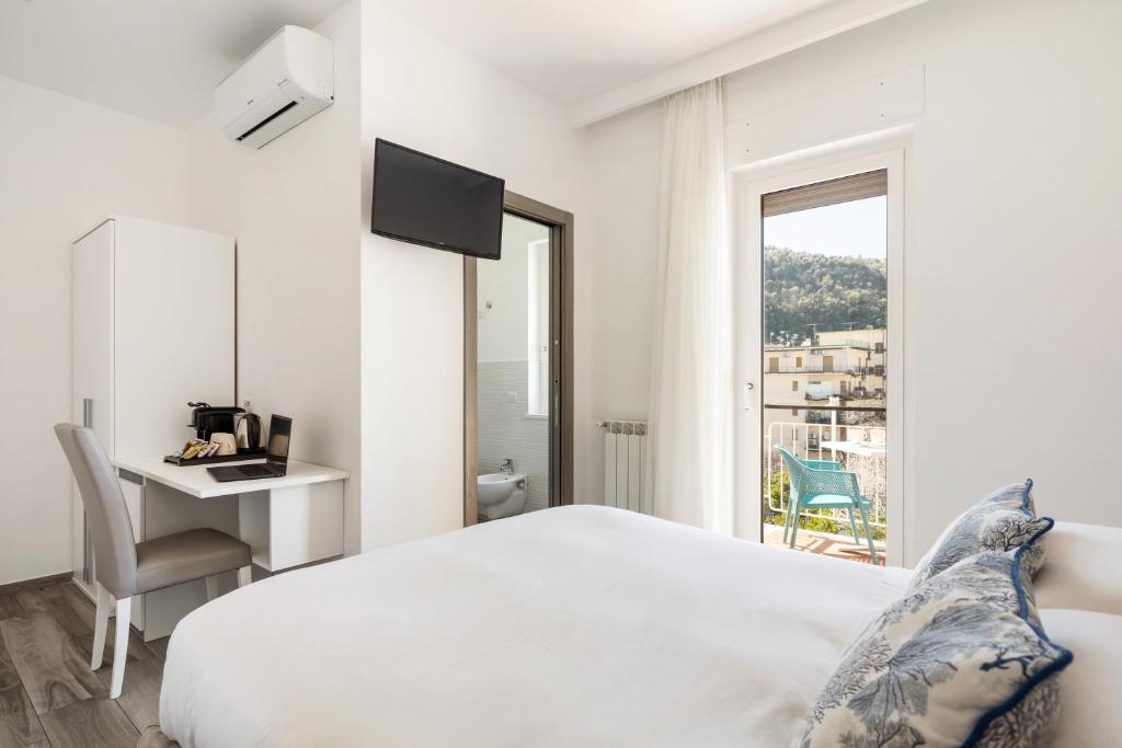 Postel nebo postele na pokoji v ubytování YourHome - Maison degli Aranci