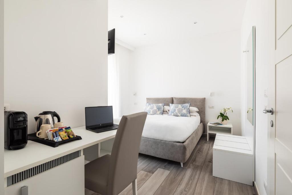 Postel nebo postele na pokoji v ubytování YourHome - Maison degli Aranci