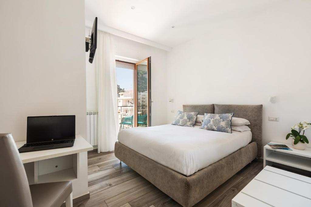 Postel nebo postele na pokoji v ubytování YourHome - Maison degli Aranci