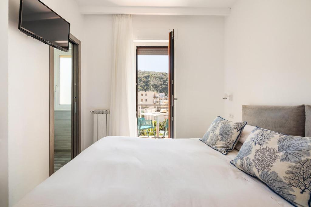 Postel nebo postele na pokoji v ubytování YourHome - Maison degli Aranci