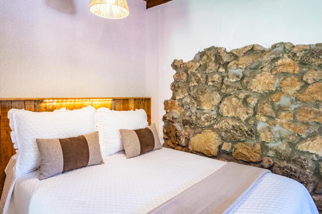 Postel nebo postele na pokoji v ubytování Apartamentos Rurales La Laguna Somiedo
