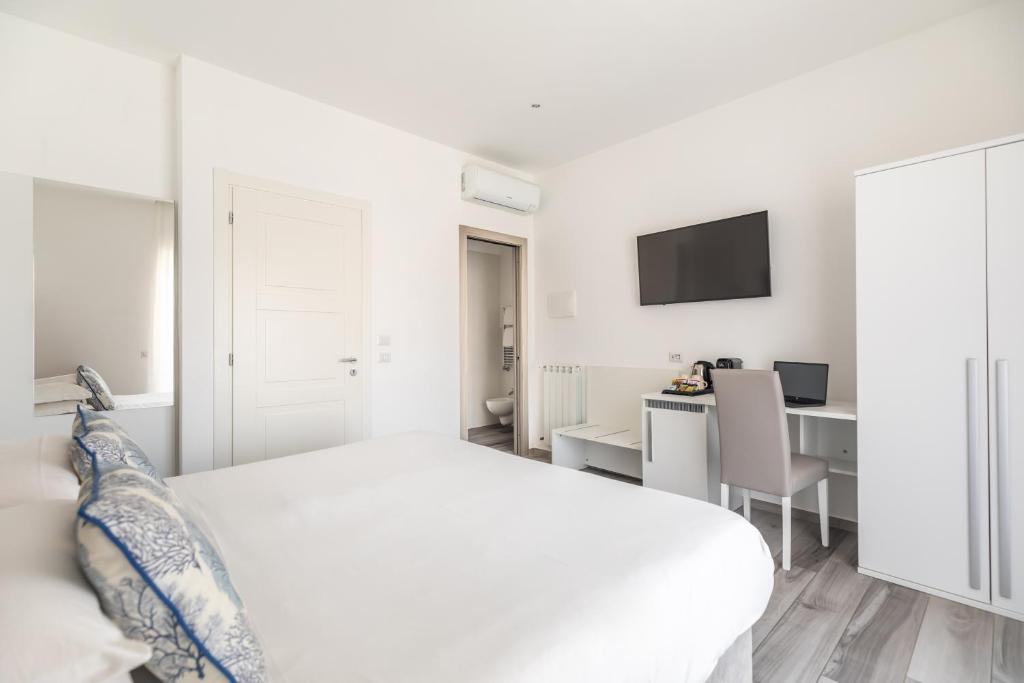 Postel nebo postele na pokoji v ubytování YourHome - Maison degli Aranci