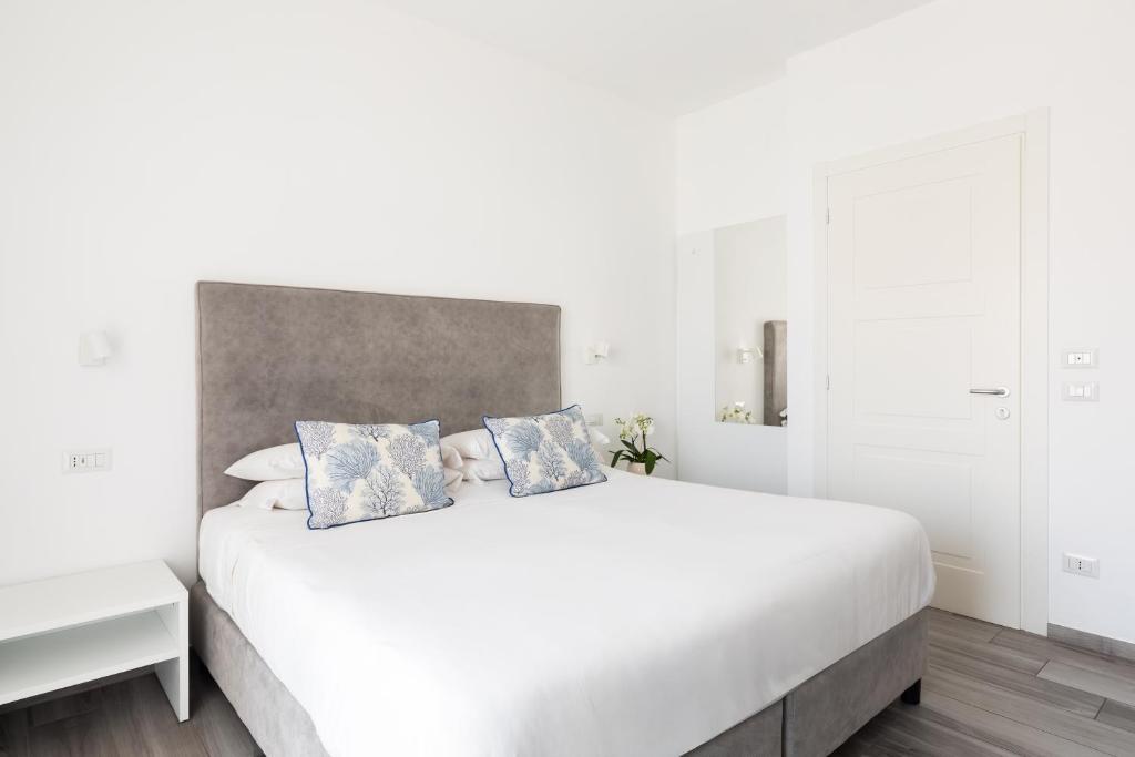 Postel nebo postele na pokoji v ubytování YourHome - Maison degli Aranci