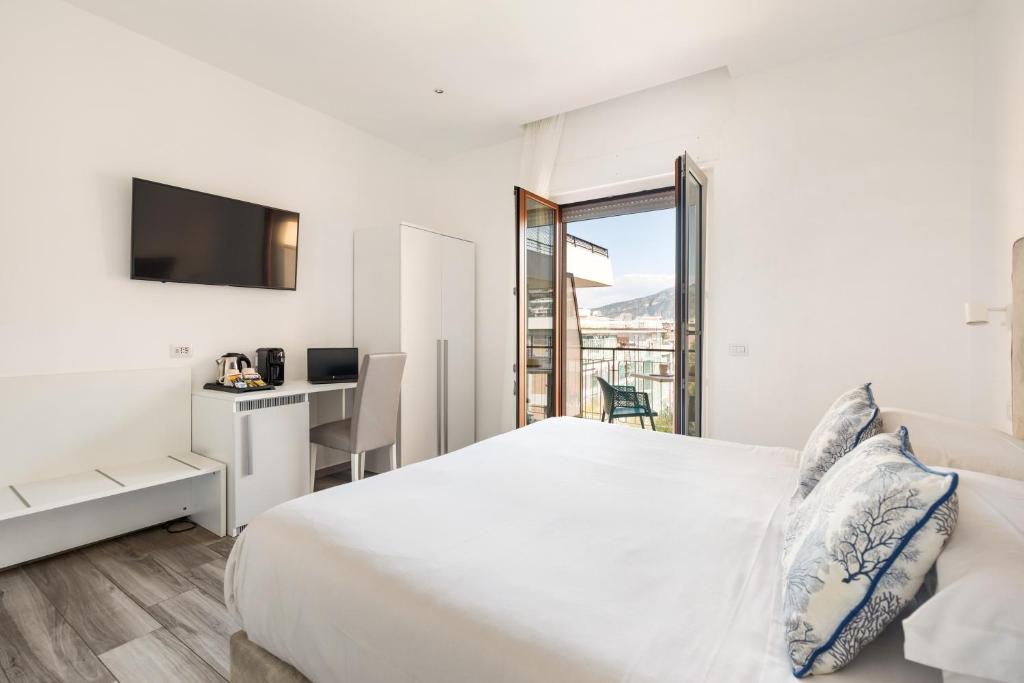 Postel nebo postele na pokoji v ubytování YourHome - Maison degli Aranci