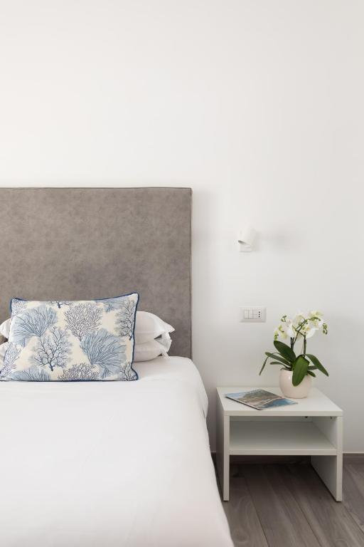 Postel nebo postele na pokoji v ubytování YourHome - Maison degli Aranci
