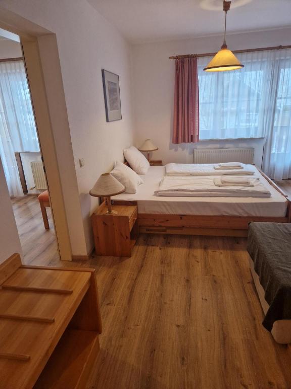Postel nebo postele na pokoji v ubytování Sporthotel Dachstein West