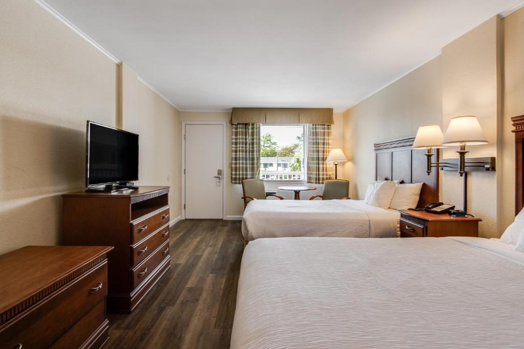 Postel nebo postele na pokoji v ubytování Oceanus Motel - Rehoboth Beach