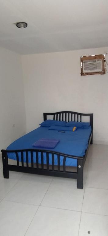 Cama o camas de una habitación en Hostal CQ Camarones