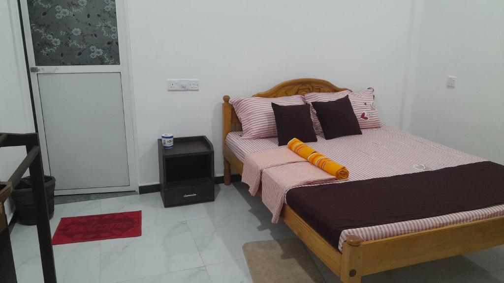 Postel nebo postele na pokoji v ubytování Theepan's Home