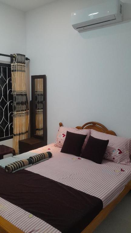 Postel nebo postele na pokoji v ubytování Theepan's Home