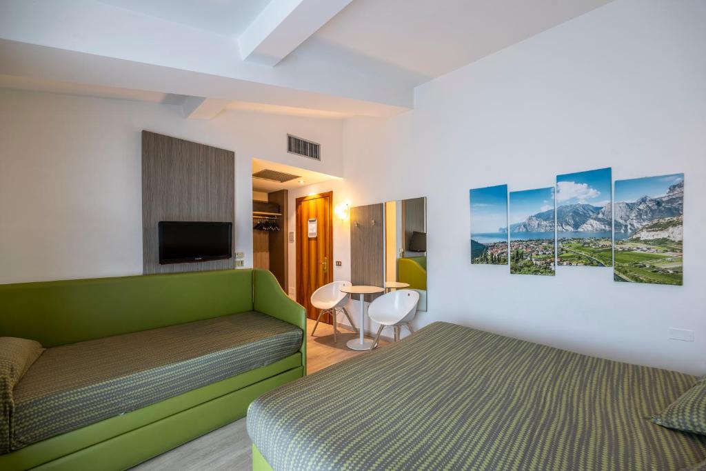 TV a/nebo společenská místnost v ubytování Hotel Ideal