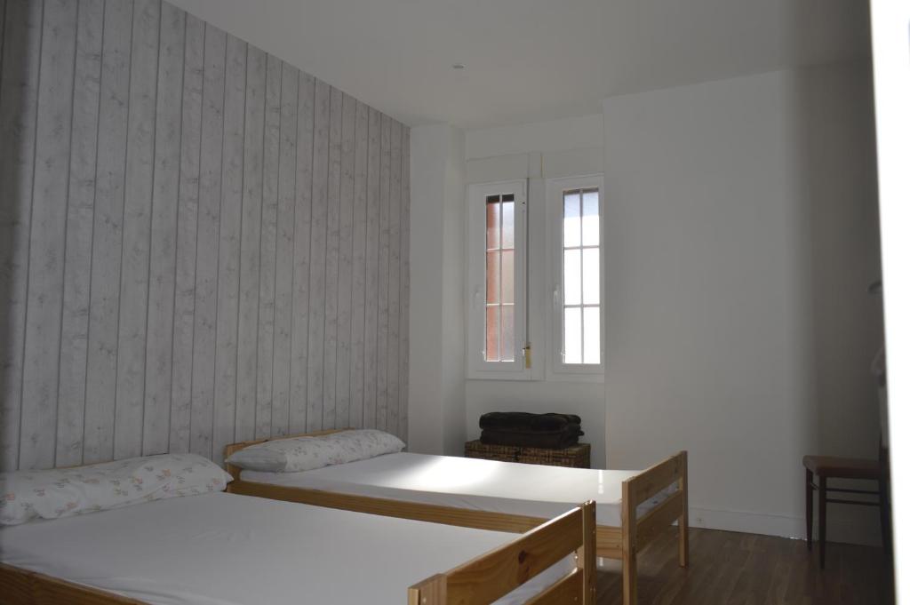 Postel nebo postele na pokoji v ubytování Albergue Gares