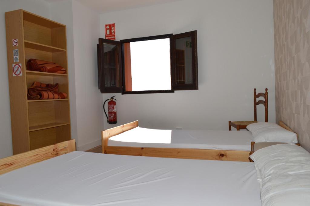 Postel nebo postele na pokoji v ubytování Albergue Gares