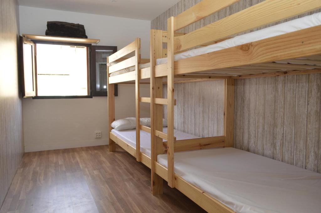 Postel nebo postele na pokoji v ubytování Albergue Gares