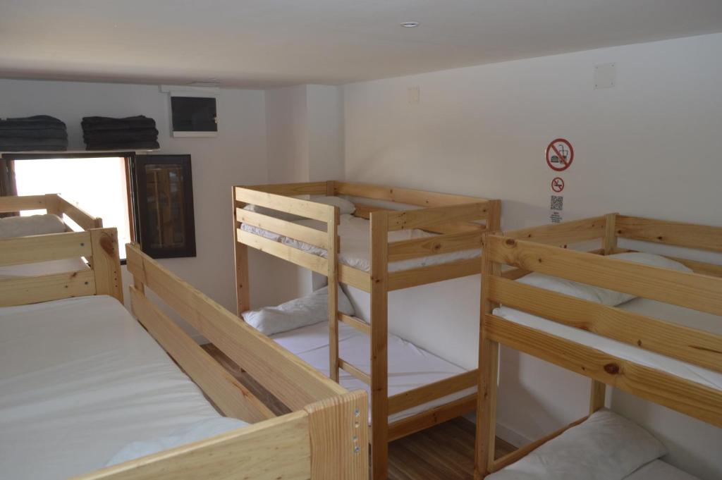 Postel nebo postele na pokoji v ubytování Albergue Gares