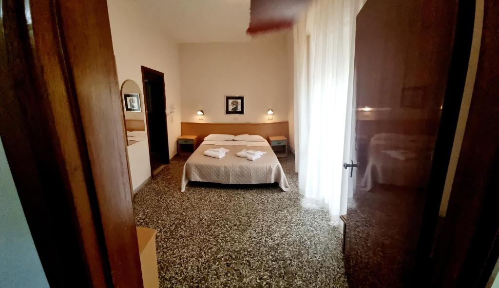 Postel nebo postele na pokoji v ubytování Hotel Anny