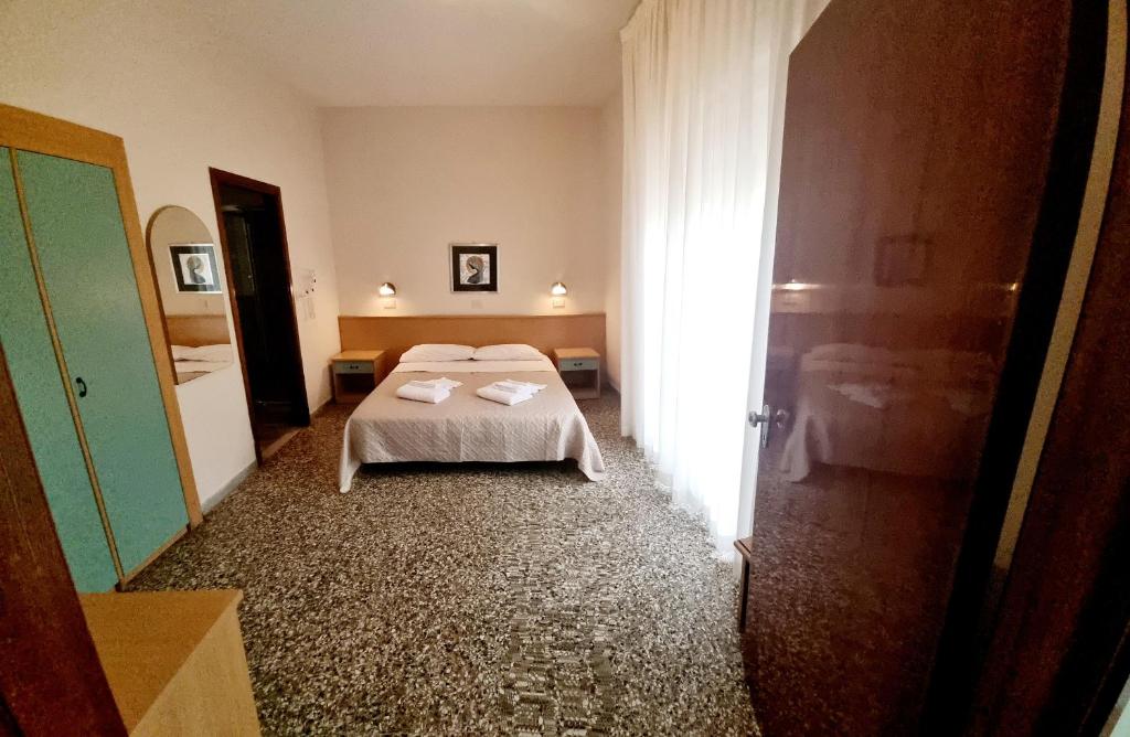Postel nebo postele na pokoji v ubytování Hotel Anny