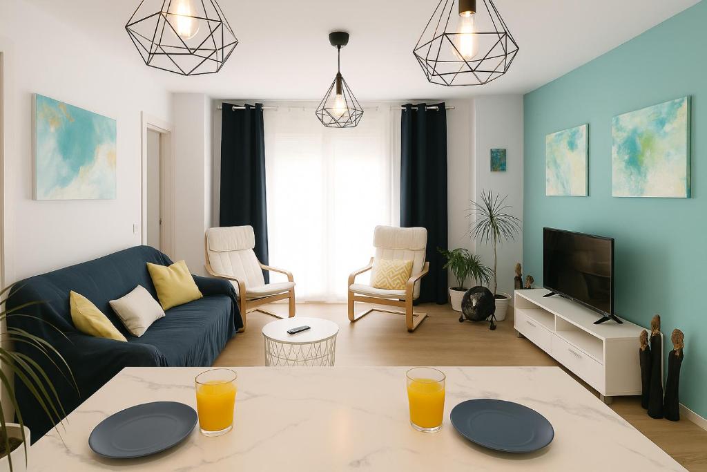 a living room with a couch and a table at Avenida del Mar 14 Junio in Castellón de la Plana