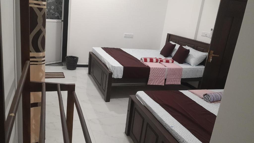 Postel nebo postele na pokoji v ubytování Theepan's Home