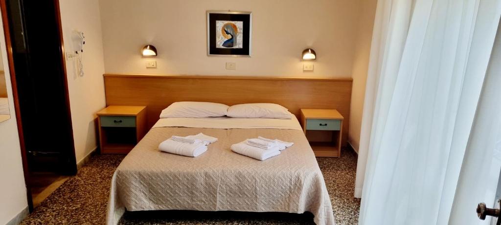 Postel nebo postele na pokoji v ubytování Hotel Anny