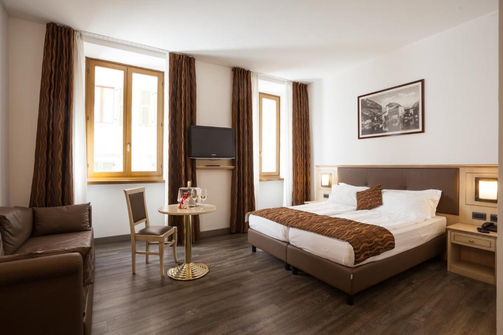 Postel nebo postele na pokoji v ubytování Hotel Portici - Romantik & Wellness